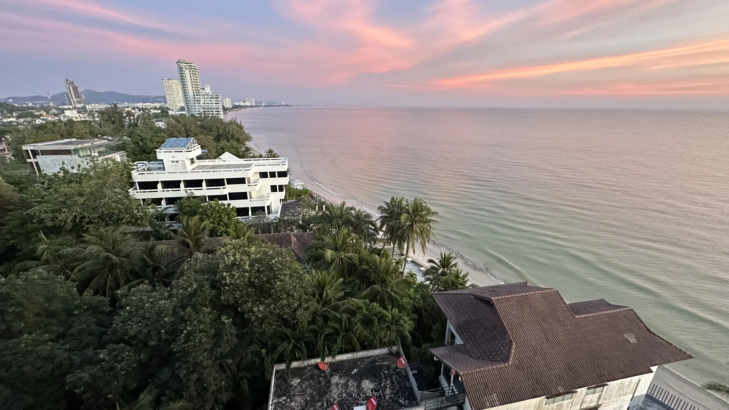 Pink dawn sky over the Hua Hin coastline from the balcony